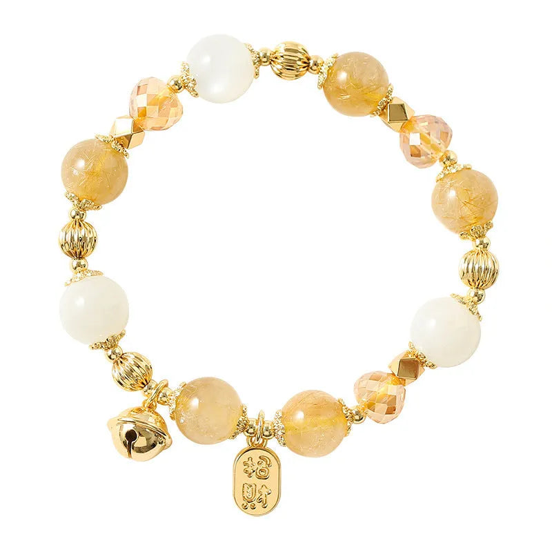 Gold electroplated bracelet with rutilated quartz crystals and a central ringing bell charm