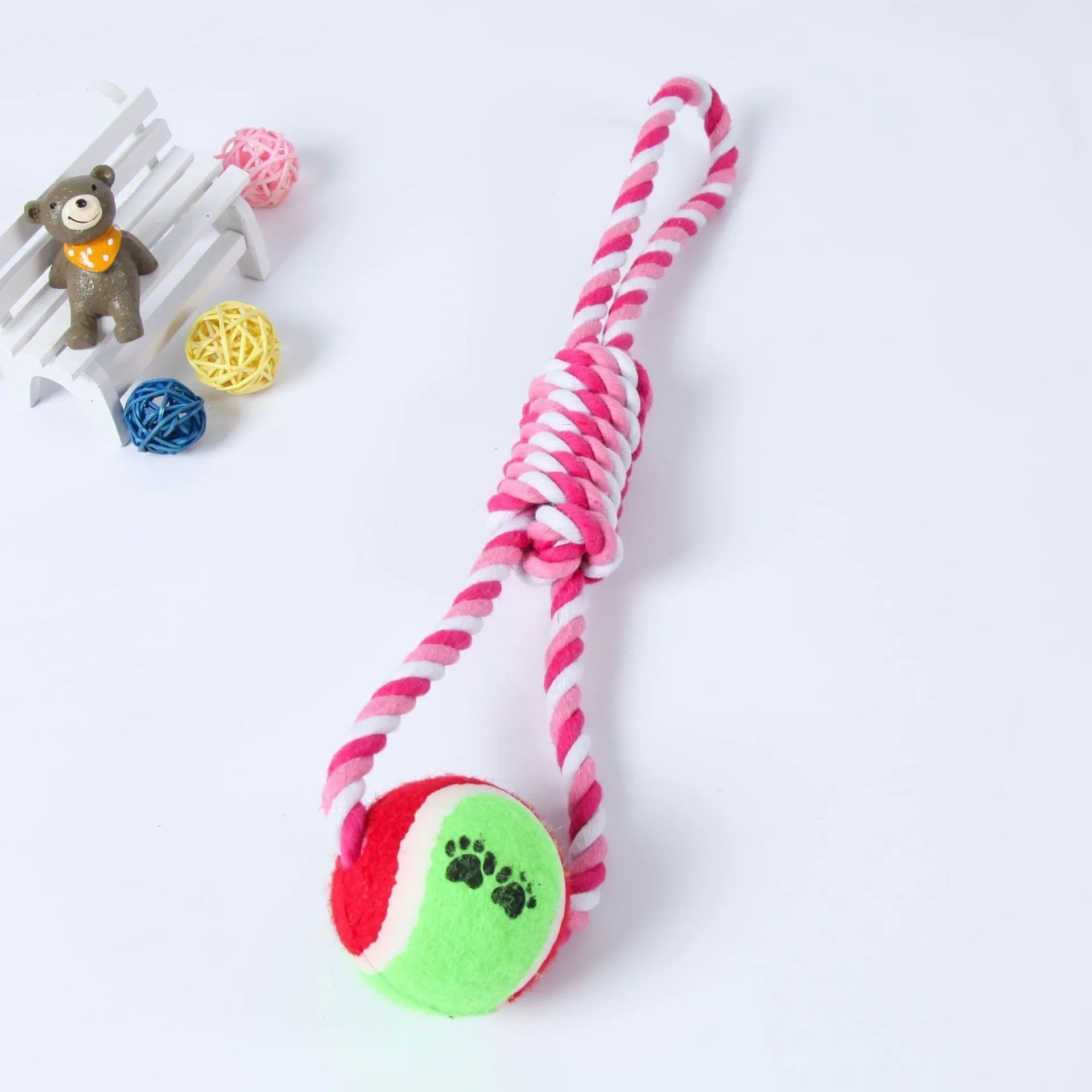 Red and white cotton rope tug toy for dogs, approximately 38cm long, laid out straight.