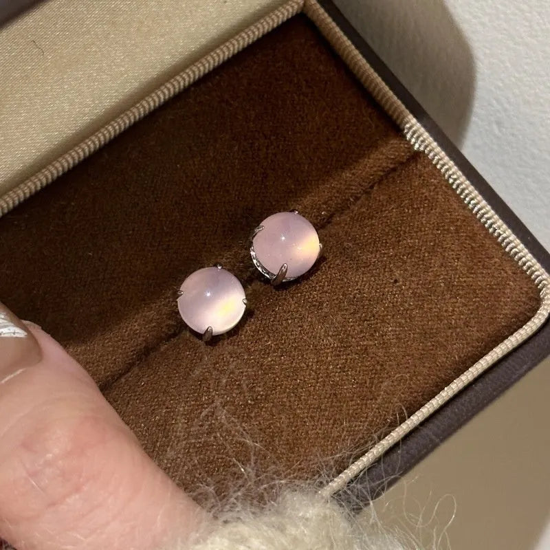 Chalcedony stud earrings with round egg stone in copper four-claw setting, emerald green colour