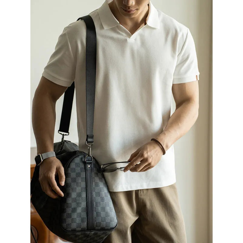 American-style short-sleeved polo shirt in a blue cotton-polyester blend on a hanger.