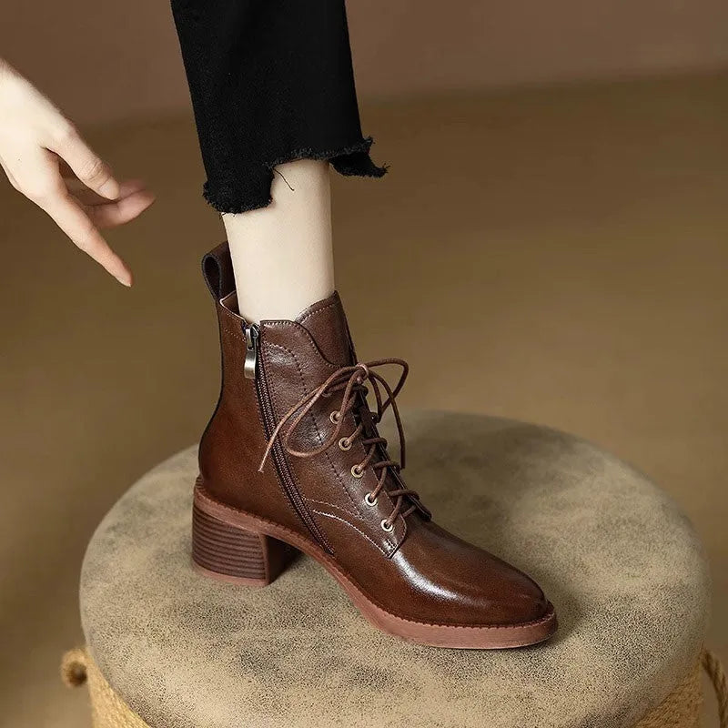 Women's black pointed-toe short tube boots with 5.5cm heel and velvet detailing on artificial PU upper