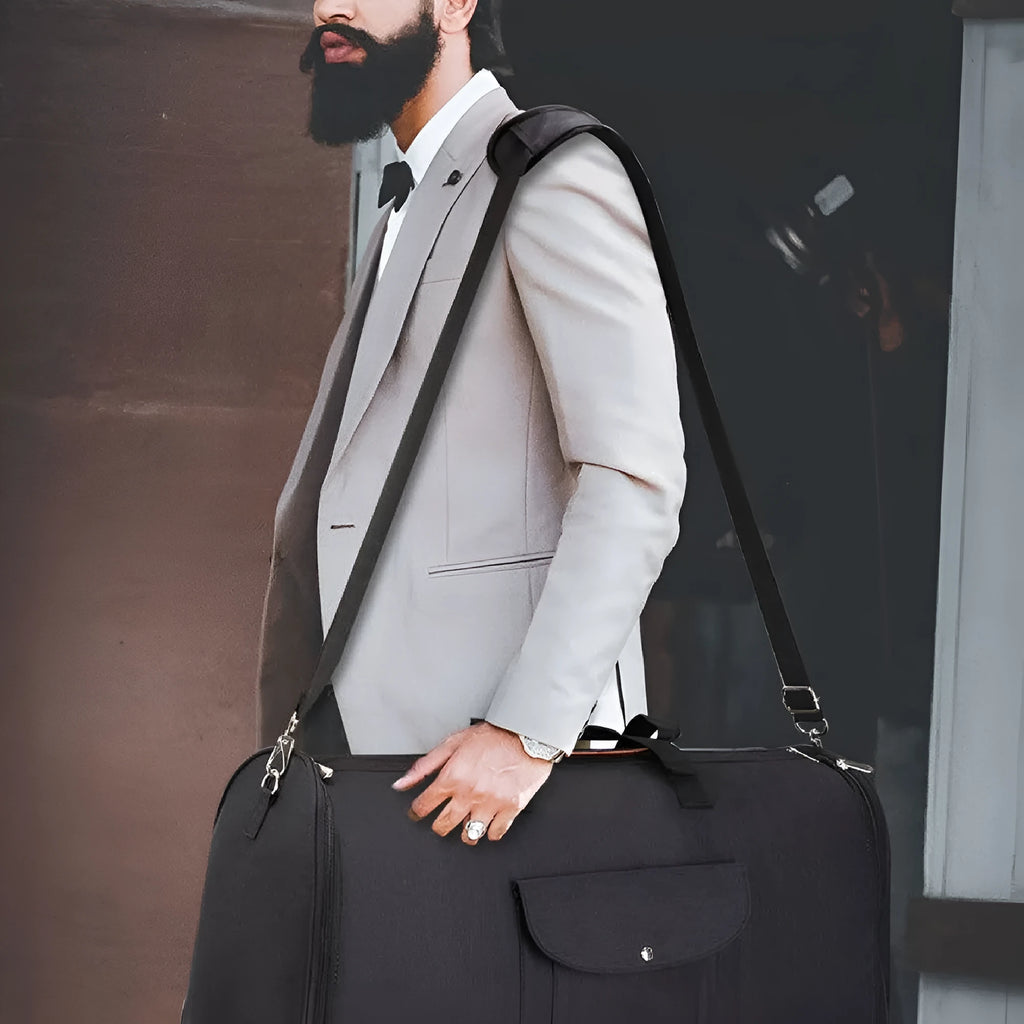 Folding duffel bag in dark blue Oxford cloth with a carrying handle, shown partially folded.