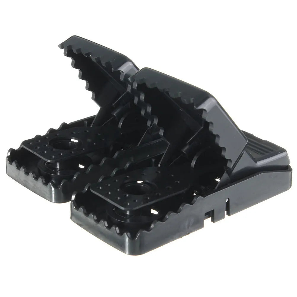 Six black plastic snapping mouse traps showing dimensions and smooth surface