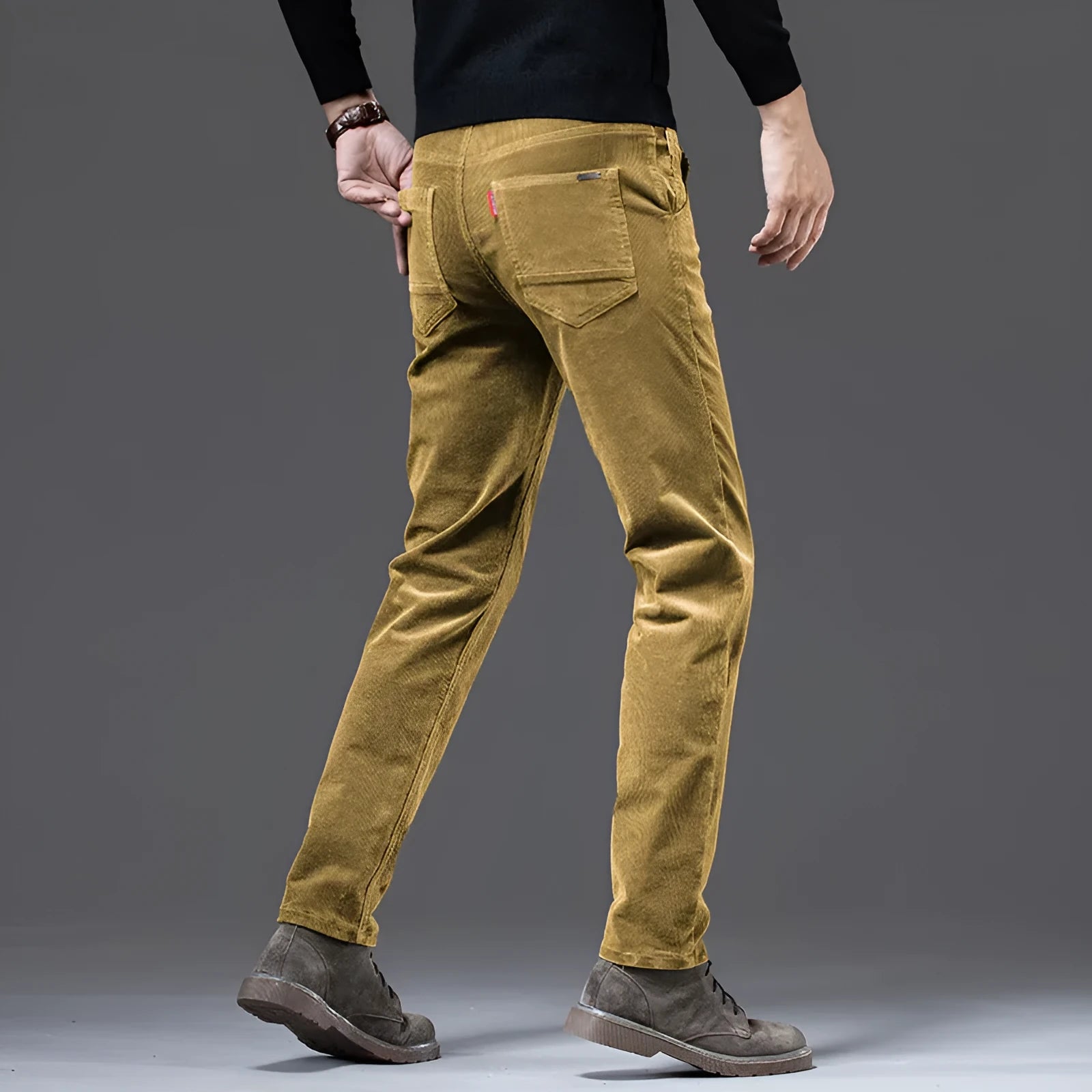 Straight slim-fit cotton corduroy trousers in brown, shown from front