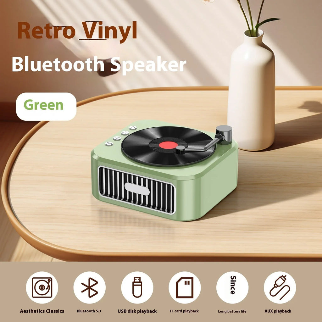 Retro jukebox-style Bluetooth speaker in sunset pink with vinyl record design and karaoke microphone.