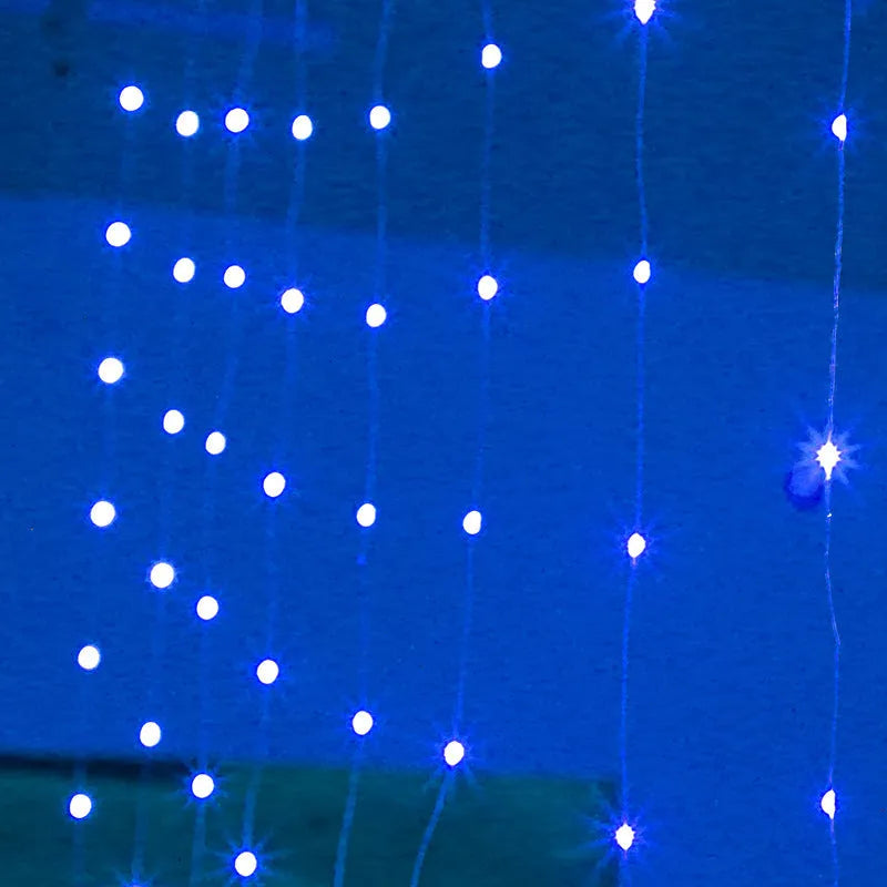 Copper curtain Christmas lights with multiple LED bulbs in blue, purple, or warm white colours for indoor and outdoor decoration