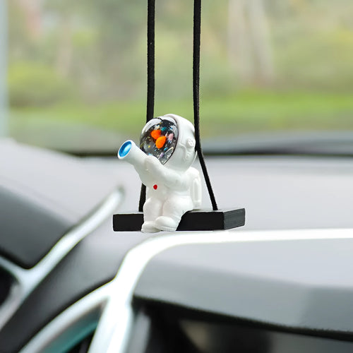 Cartoon astronaut resin pendant for car decoration, shown in various colour and style options.