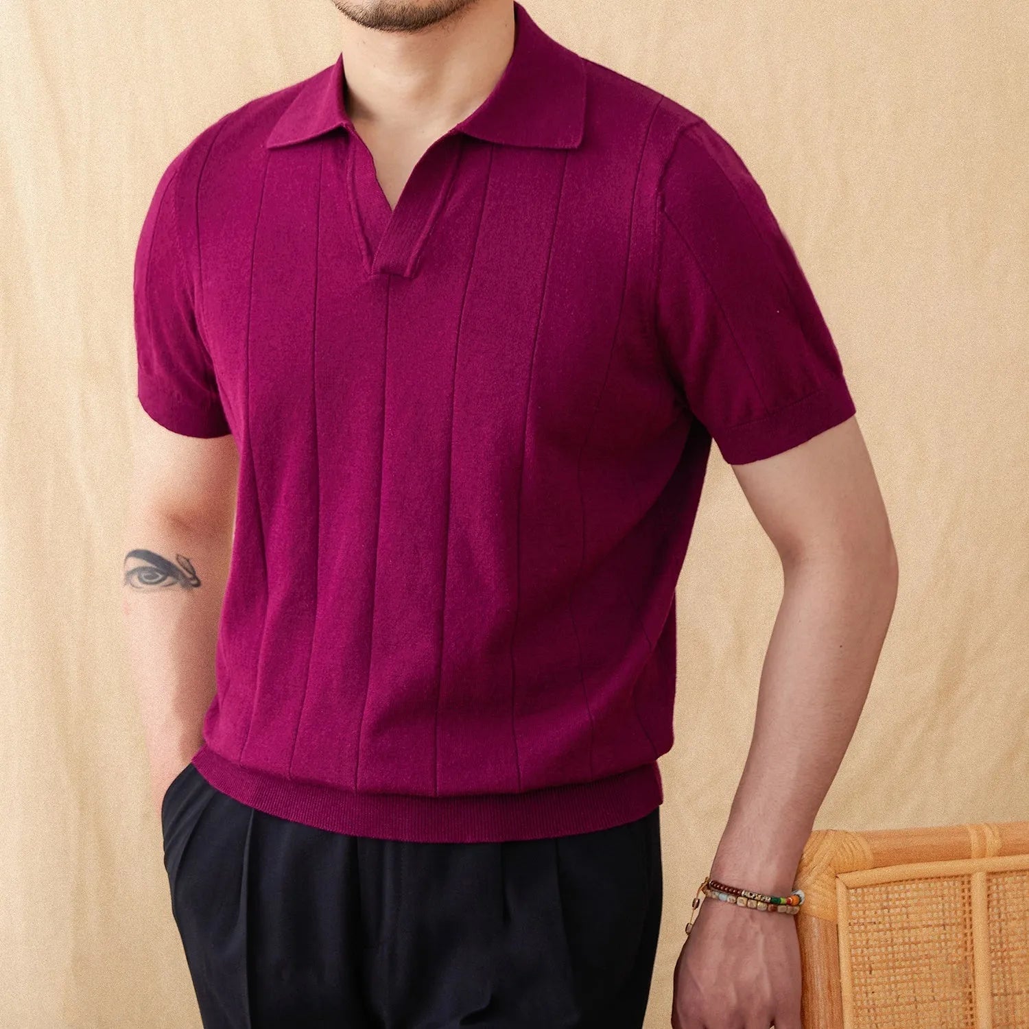 Short sleeve knitted polo shirt in a ramie-cotton blend with a seagull collar, shown in purple.