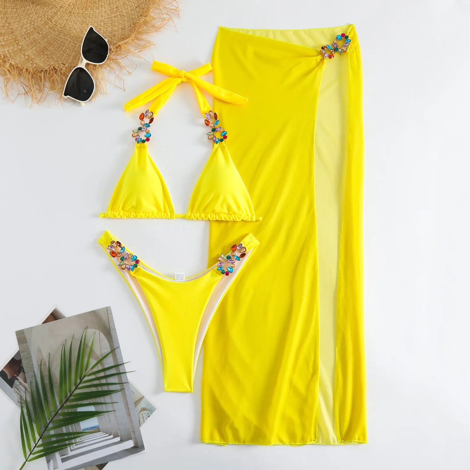 Rose Red three-piece swimsuit set with bikini top, bottoms, and long mesh skirt laid flat.