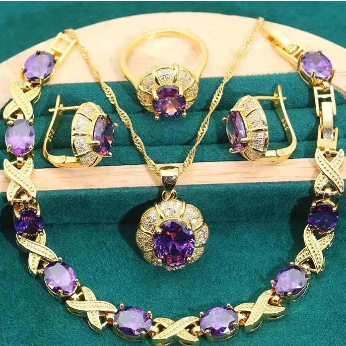 18k gold plated jewellery set with cubic zirconia stones showing necklace, earrings, ring and bracelet
