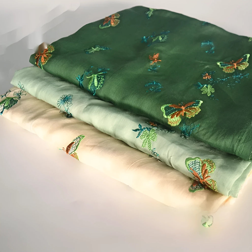 Pure ramie embroidery cloth Hanfu fabric in beige, grass green and dark green colours showing texture