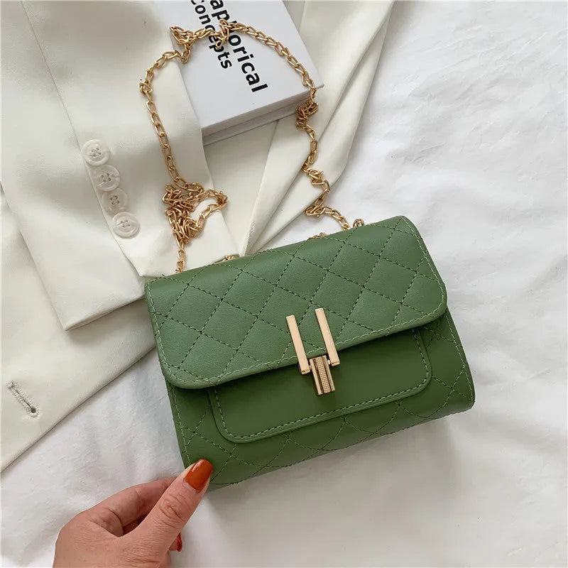 Women's white PU crossbody bag with diamond lattice texture and adjustable chain shoulder strap
