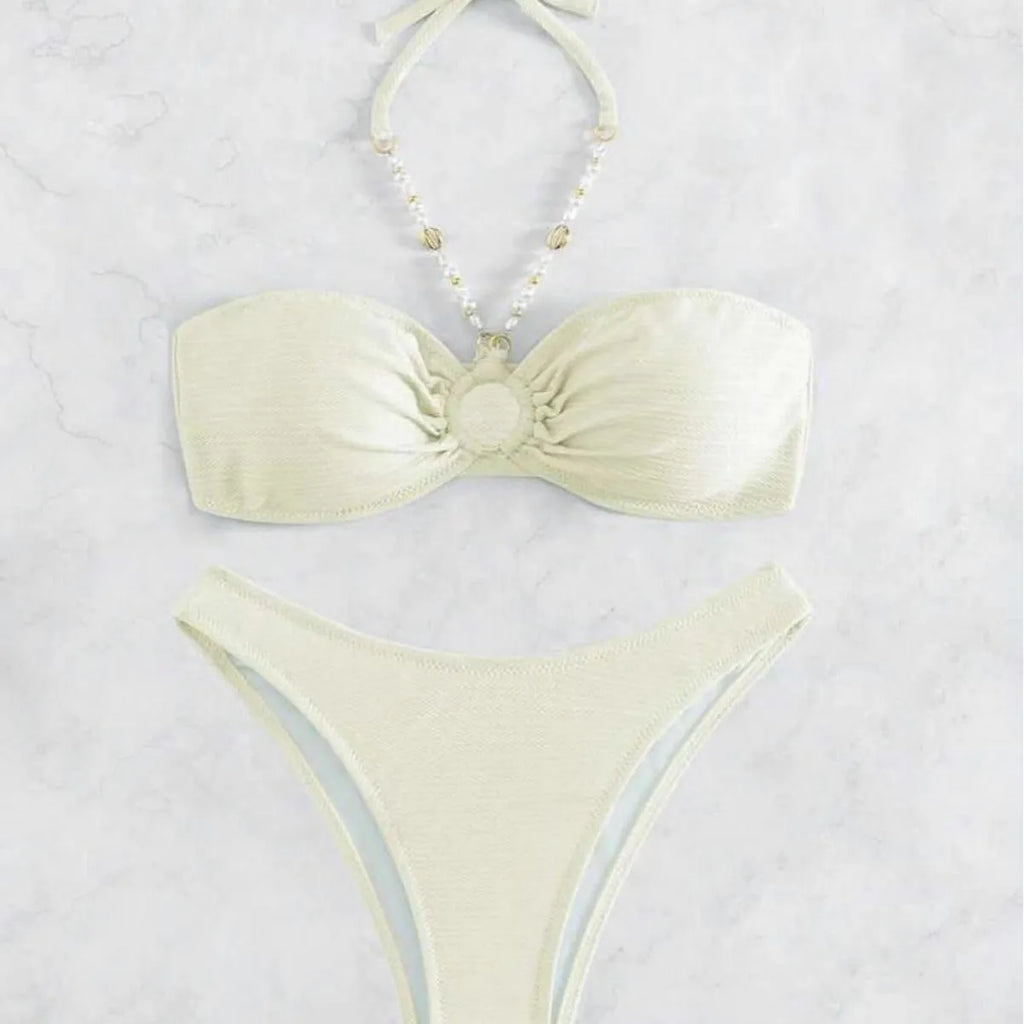Women's solid colour halter neck bikini set on a white background, shown in creamy-white.