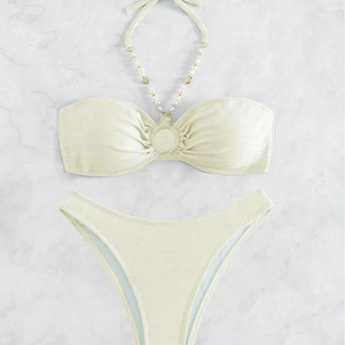 Women's solid colour halter neck bikini set on a white background, shown in creamy-white.