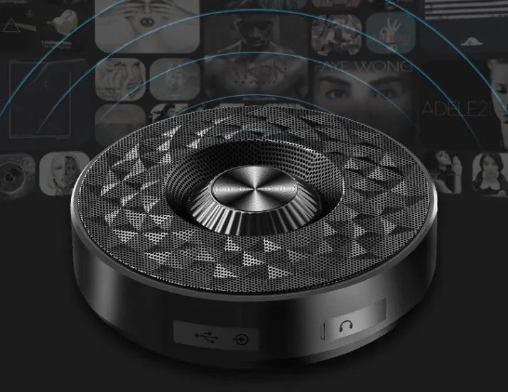 Compact circular black wireless Bluetooth sound box with multi-colour LED lights around its edge.