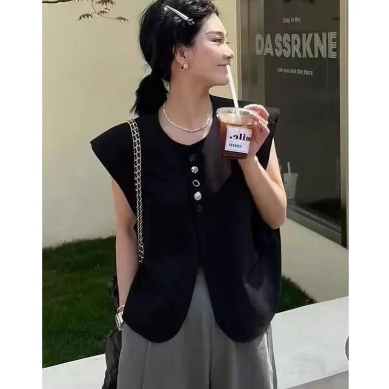 Women's polyester vest in milky white or black with pocket detail and loose fit