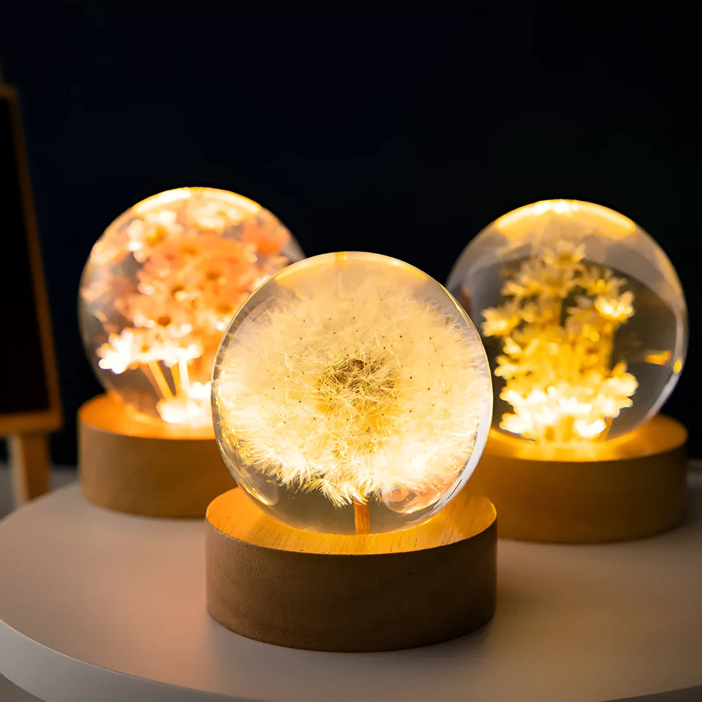 Luminous 3D dandelion crystal ball on a beech wood stand, glowing as a USB-powered desktop night light.