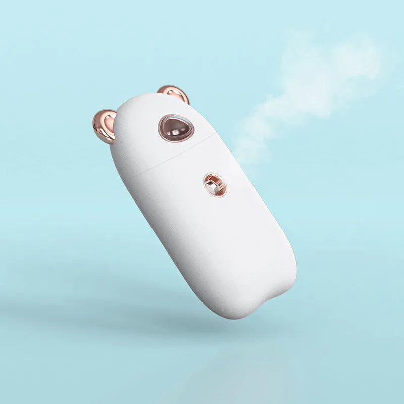USB rechargeable portable hand humidifier and face steamer in white with cold spray mist