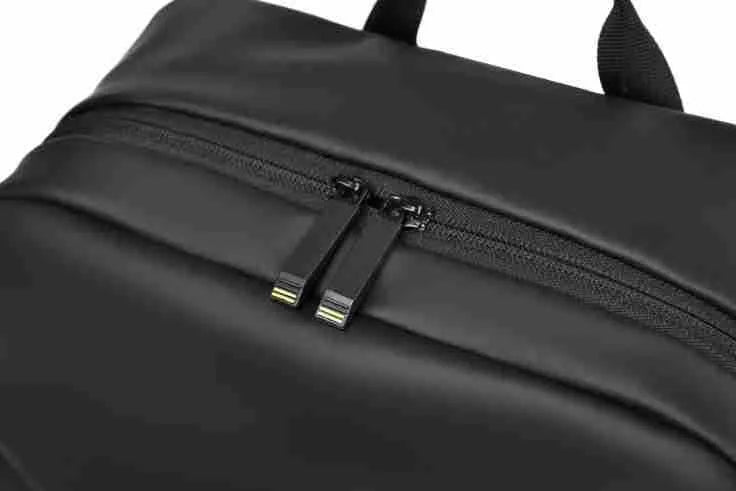 Large black waterproof backpack with 40 litre capacity and PU leather construction