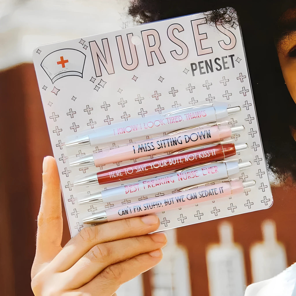 Set of five plastic retractable ballpoint pens with nurse-themed text and slogans.