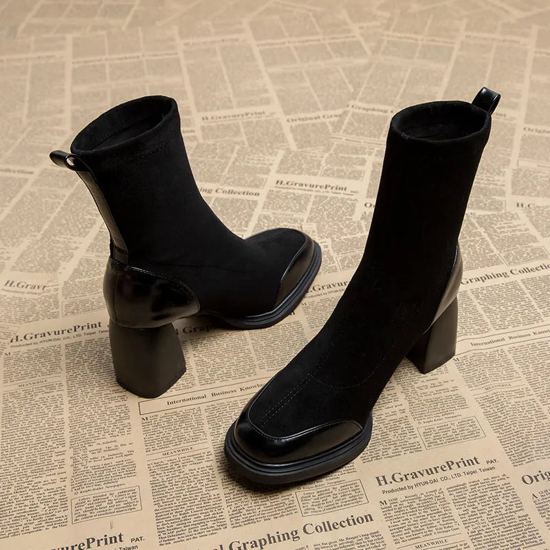 Genuine leather women's short martin boots in black matte finish with high heel and rubber sole