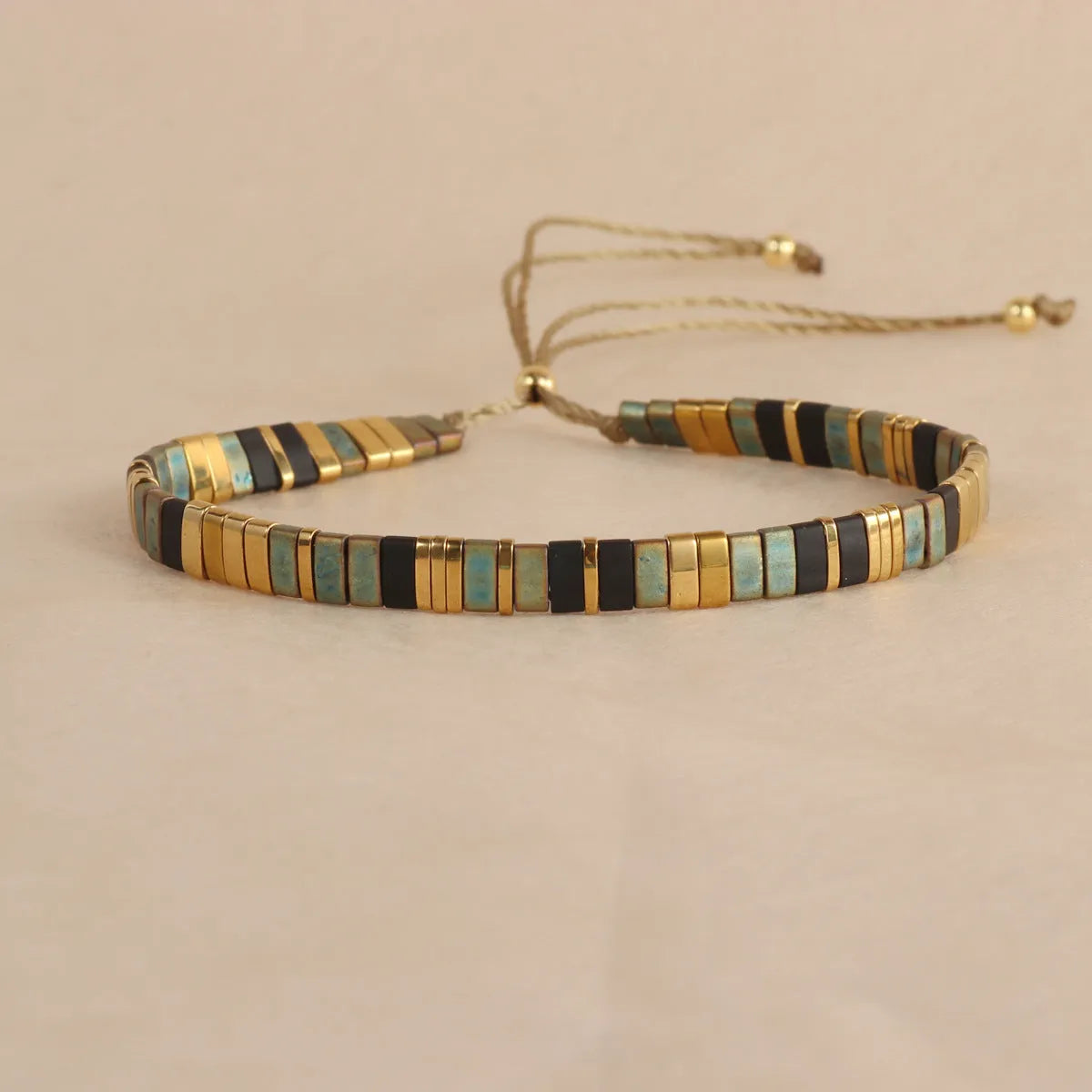 Geometric glass and coloured glaze beaded bracelet with round elements in five colour options