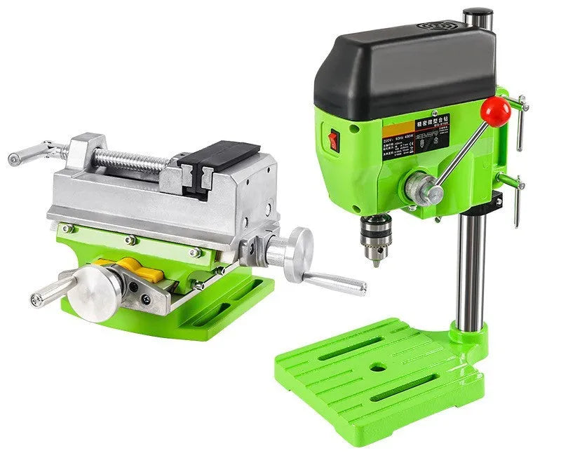 Bench drill milling machine on a workbench with cross bench pliers.
