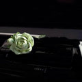 Solid gypsum car vent air freshener in jasmine fragrance, showing off-white or green colour.