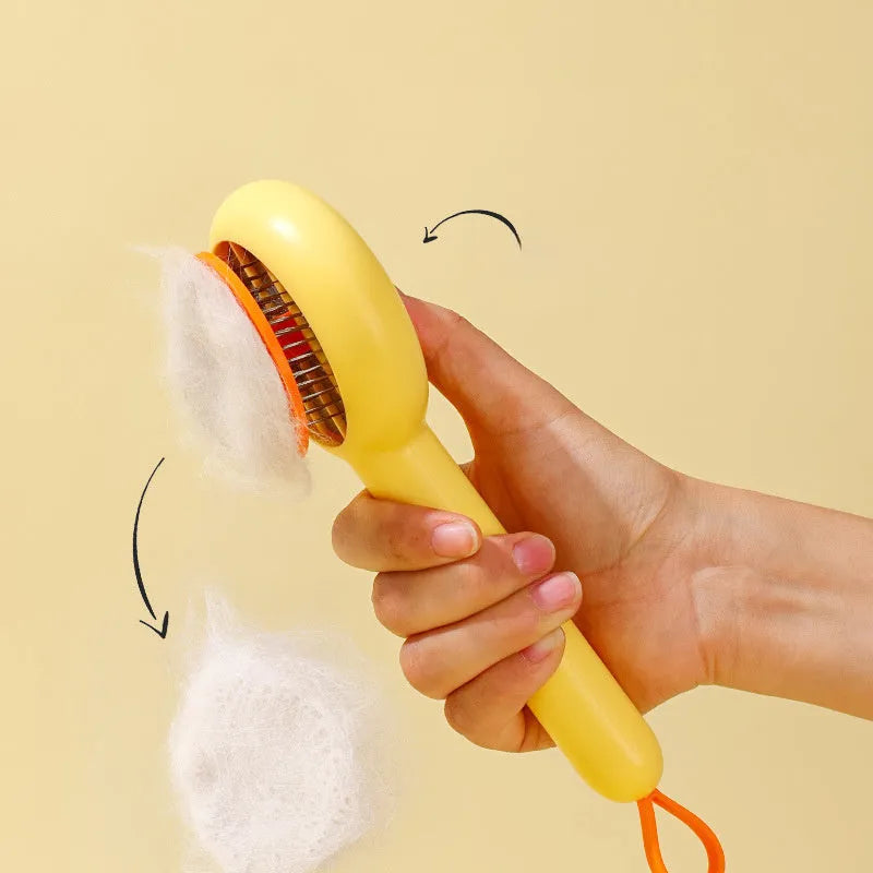 Small yellow duck-shaped pet grooming comb with needle teeth for cat and dog hair removal