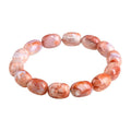 Natural cherry agate bracelet with barrel shaped beads and carved Ruyi symbols
