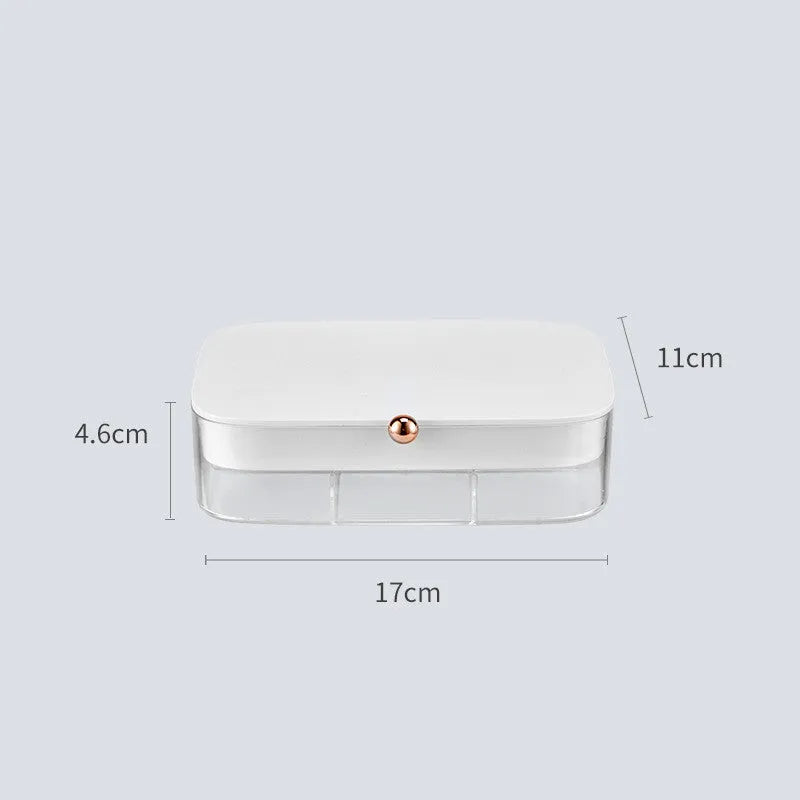Modern minimalist green jewellery storage box with multi-layer compartments open on a dressing table.