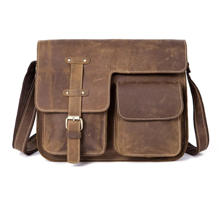 Vintage brown leather messenger bag with antique brass buckle and crossbody strap