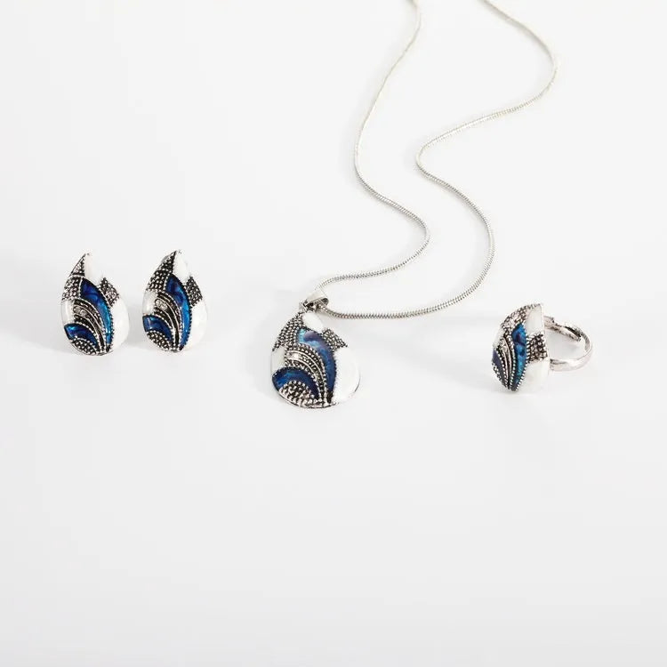 Water drop jewelry set including necklace, earrings and ring in gold or silver zinc alloy finish.