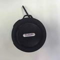 Portable waterproof Bluetooth speaker in blue with a mountaineering buckle clip for bags.