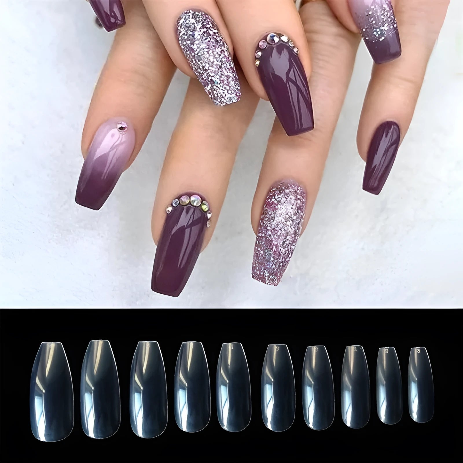 500 clear acrylic false nails in various sizes spread out on a table