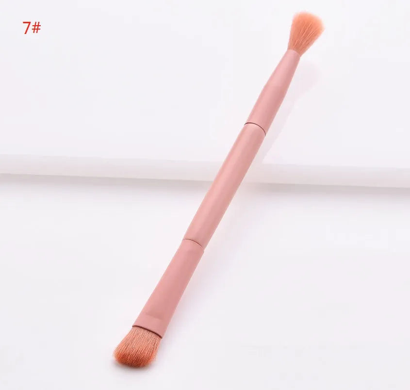 Open case showing 10 pink-handled makeup brushes including loose powder, foundation, flat head, and double-ended brushes.