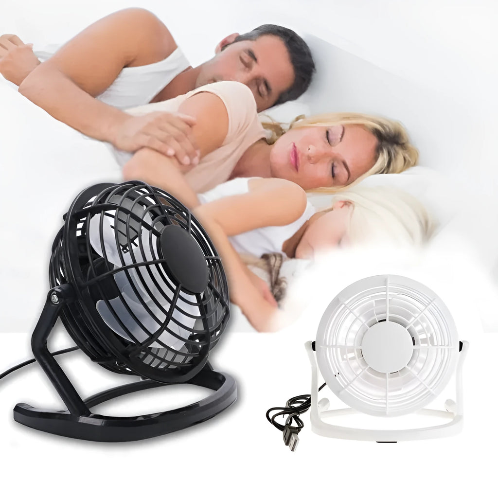 Black mini USB desktop fan with adjustable angle on wooden desk
