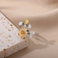 Simple open mouth adjustable copper ring in gold colour on a grey background