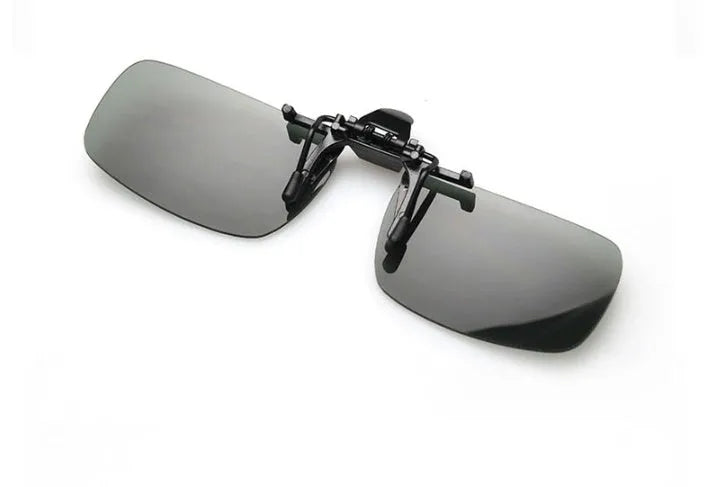 A clip-on sunglasses accessory with PC lenses shown in dark green, grey, and night vision tints, designed to fit over prescription glasses.