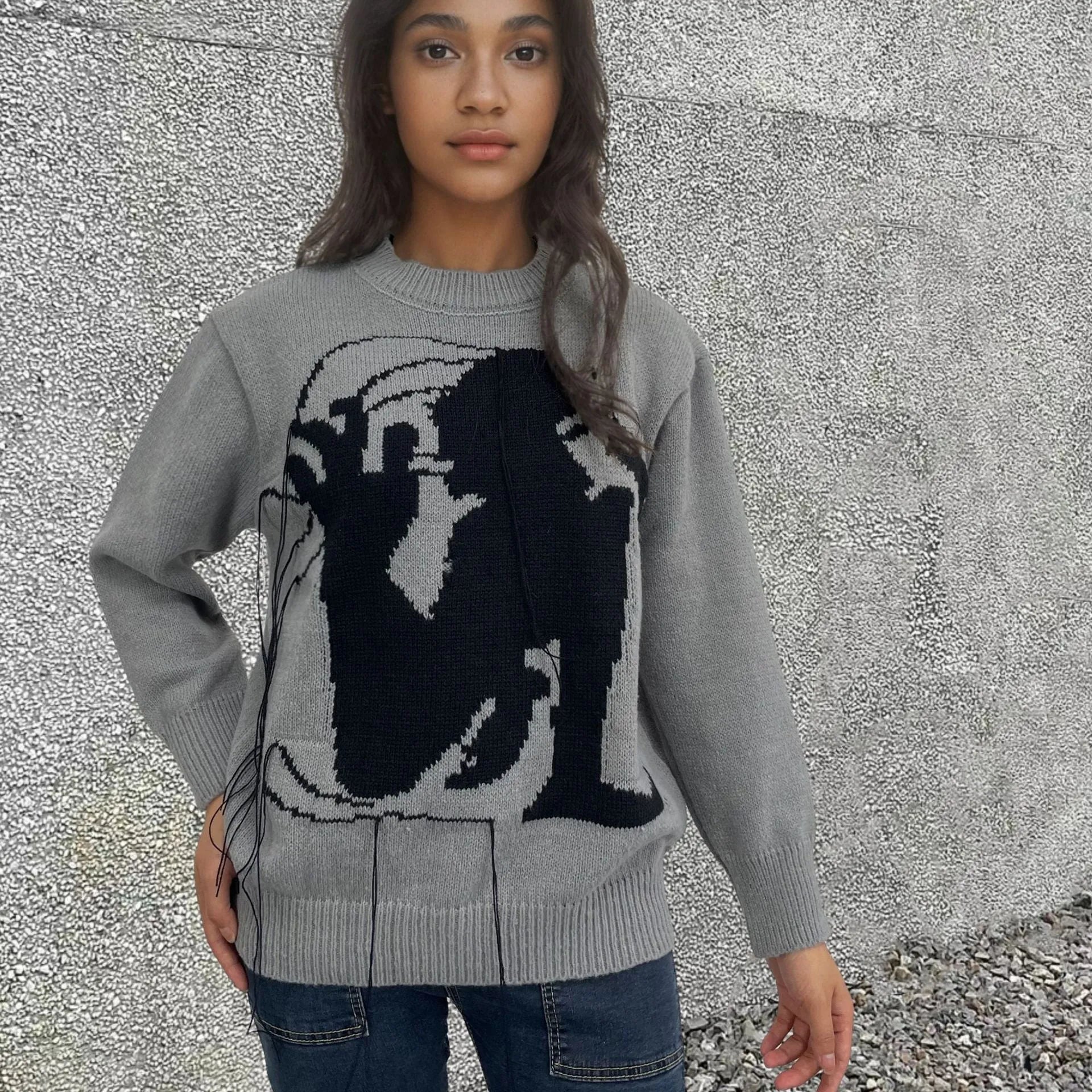 Women's loose Alpaca wool sweater with tassel design and abstract pattern in grey colour