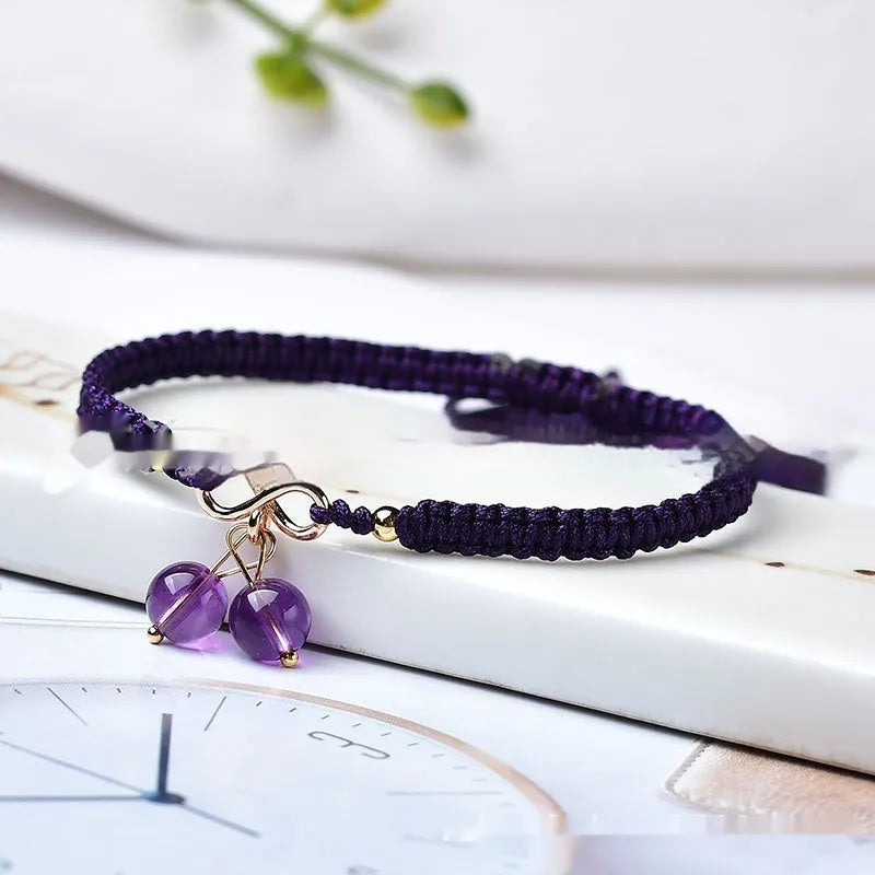 Women's natural strawberry quartz bracelet with detailed cherry charm and crystal beads.