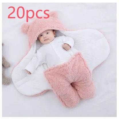 Baby quilted sleeping bag wrapper in cotton blend fabric, shown in grey colour with size tag.