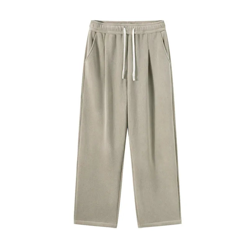 Men's apricot coloured loose-fit polar fleece trousers with a drawstring waistband, shown laid flat.