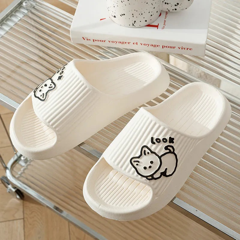Women's green cat slippers with thick EVA platform sole on a wooden floor