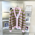 Pink wool knitted cardigan sweater showing cardigan and round-neck pullover style options