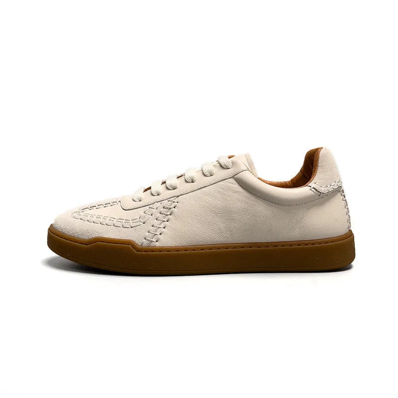 Men's beige genuine leather low-cut sneakers with white lace-up front and rubber sole on neutral background