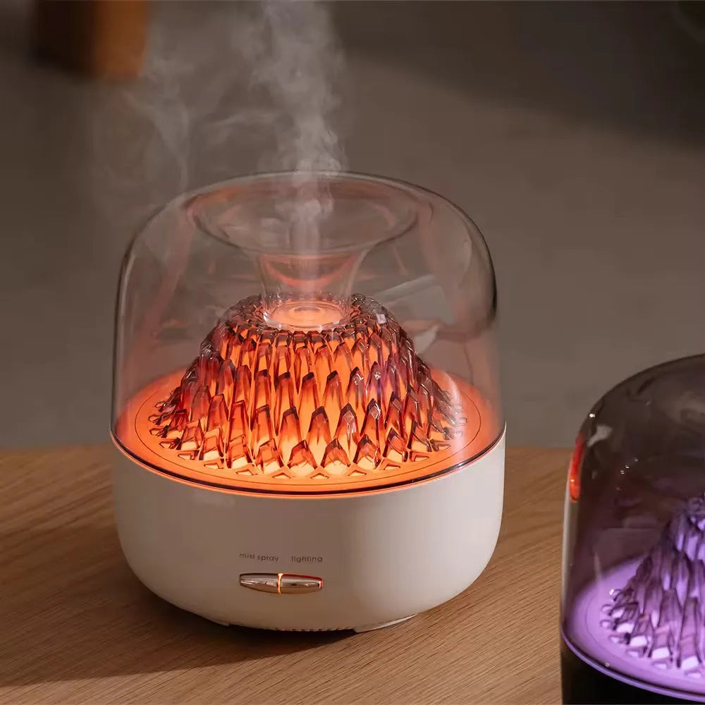 Round resin aroma diffuser with colourful light in beige, on a desktop, with a single fog nozzle