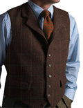 Men's army green plaid tweed gilet vest on a model, showing sleeveless wool-blend waistcoat