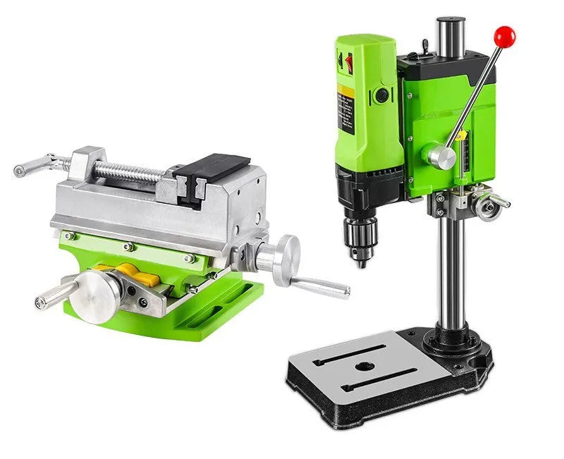 Bench drill milling machine on a workbench with cross bench pliers.