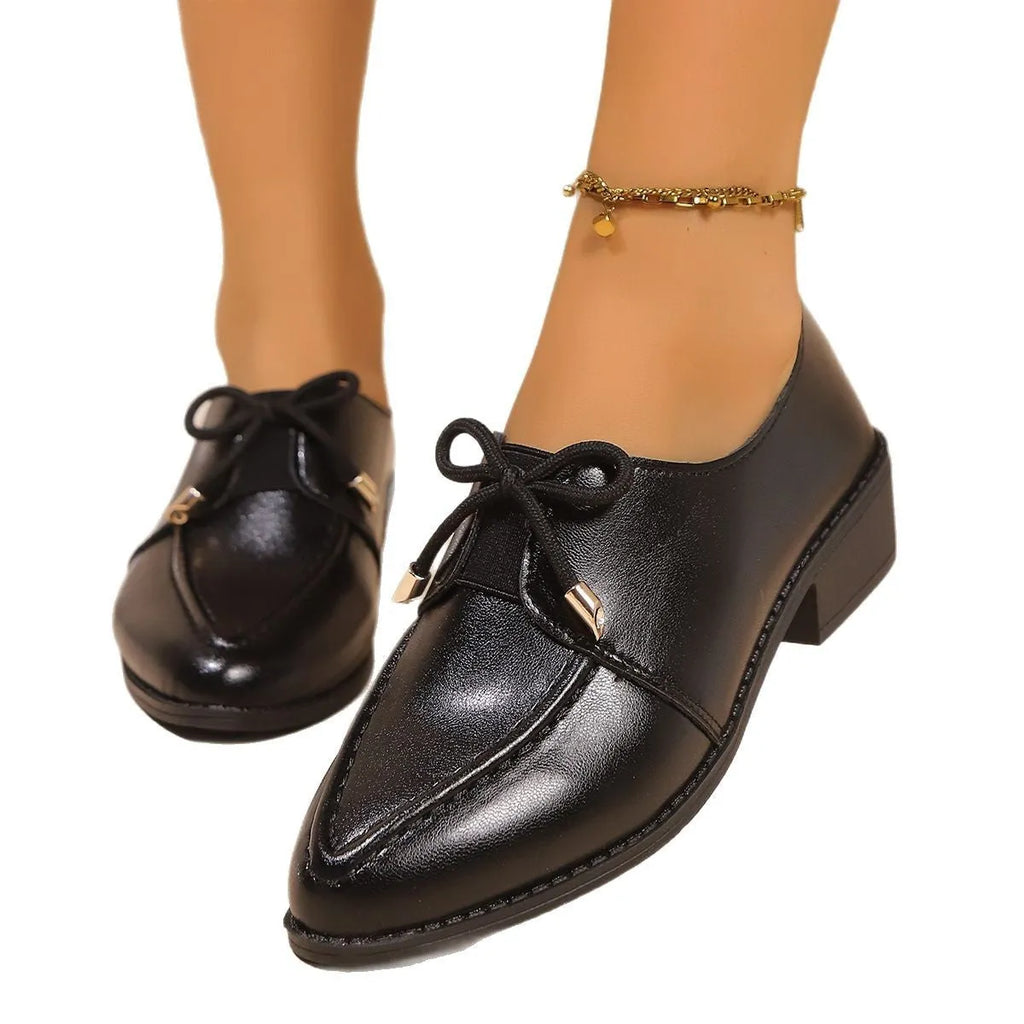 Women's British-style leather shoes with bow detail showing PU upper and rubber sole construction
